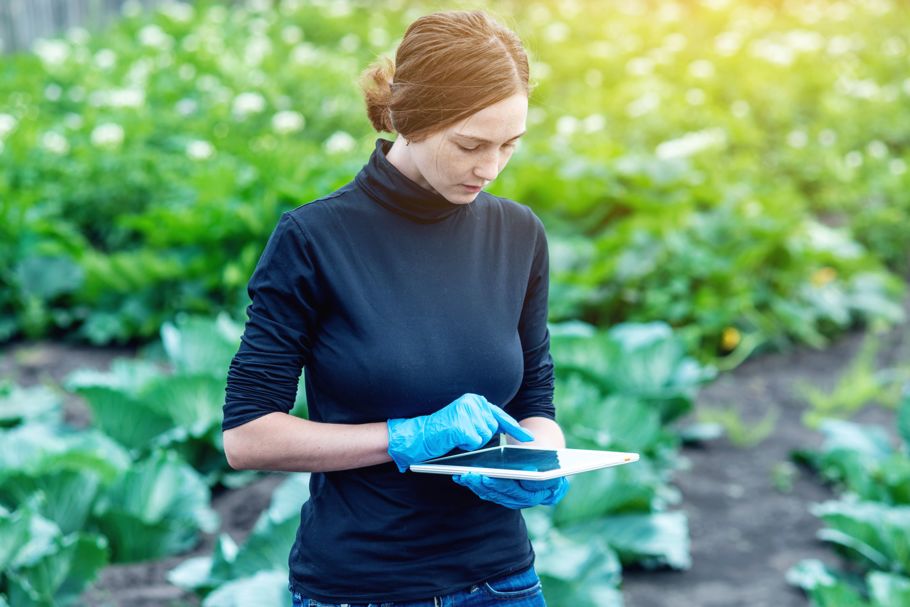 Woman with smart farming tablet
